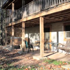 The patio area and rear deck on the Chicasaw Cabin