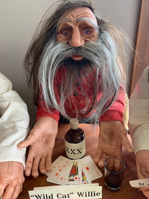 man sitting at the table and drinking sculpture