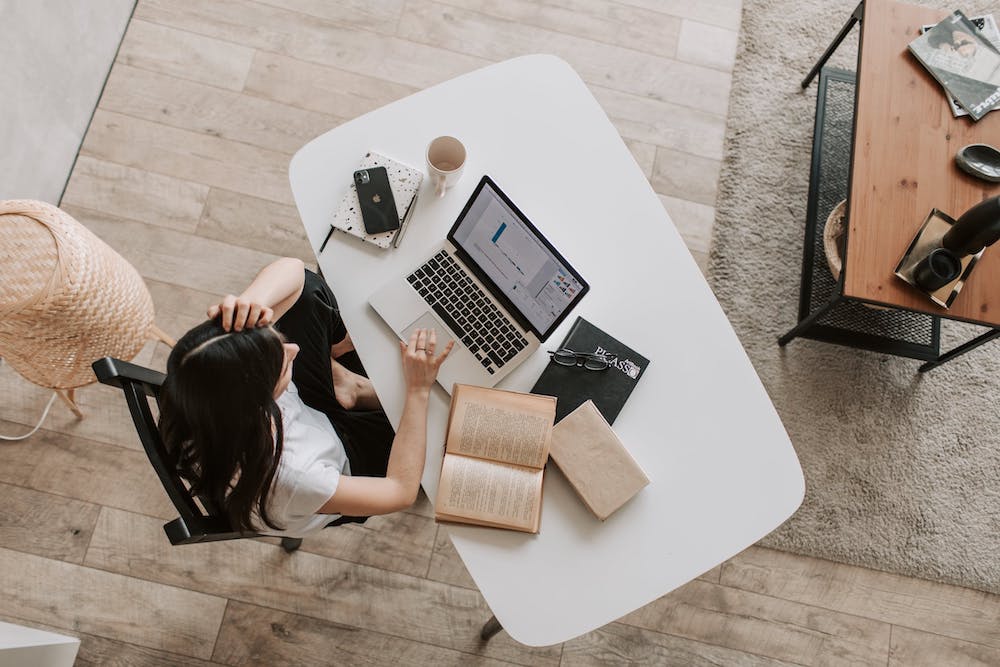 Woman working on a laptop at the desk