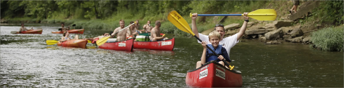 father and son canoeing down the hocking river