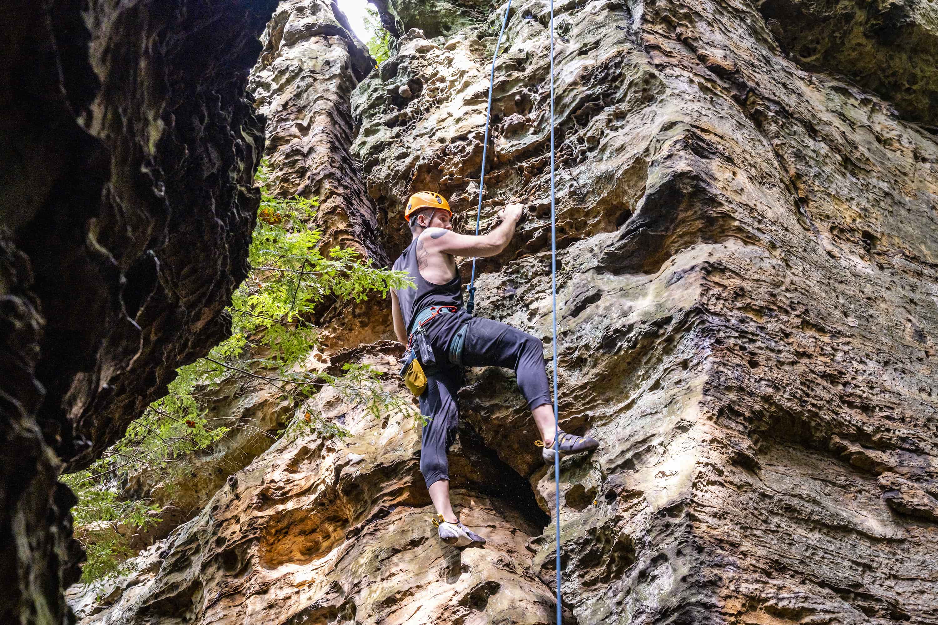 Man climbing a cliff wall