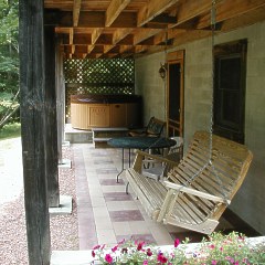 The patio area and rear deck on the Chicasaw Cabin